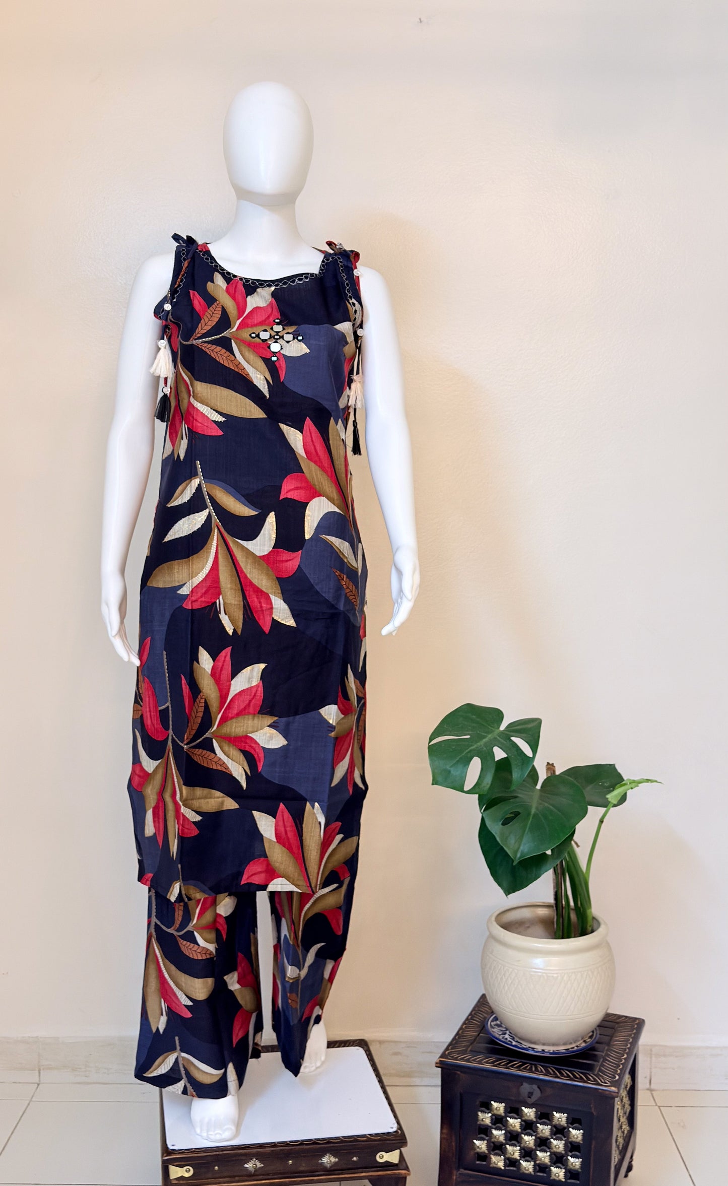 Mannequin wearing a colorful floral coordset.