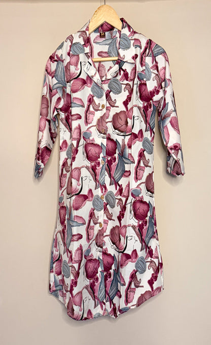 Floral patterned shirt with coordset on a hanger against a beige background