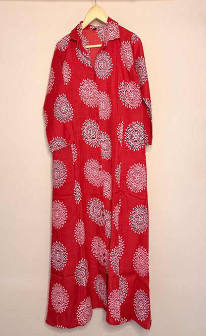 Red dress with white mandala patterns on a beige background