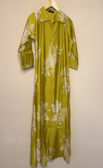 Mustard floral dress on a hanger against a beige wall