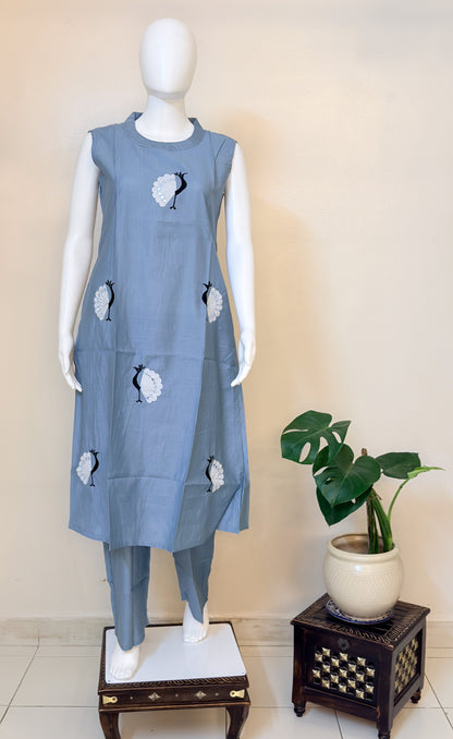 Mannequin wearing a sky blue coordset with morni patterns.