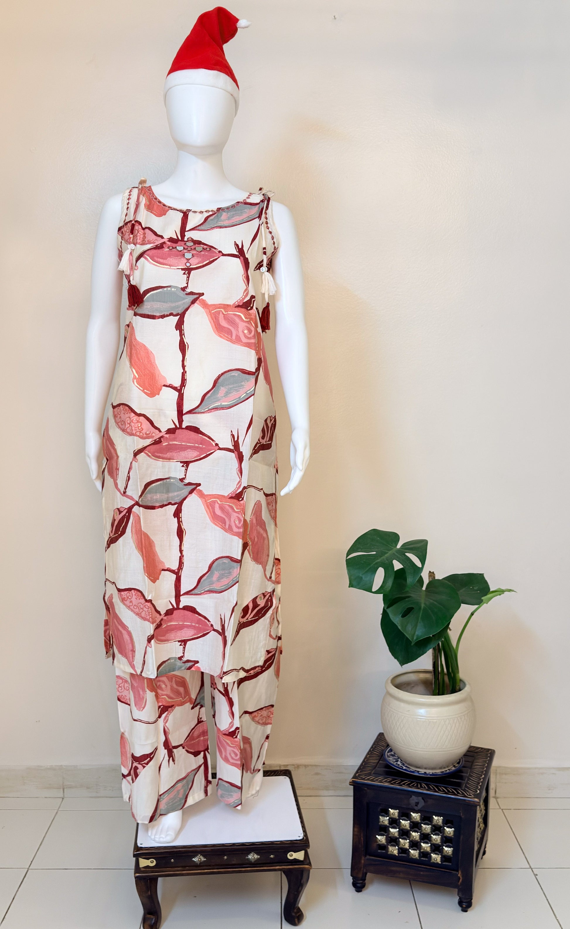 Mannequin wearing a beige  floral coordset.