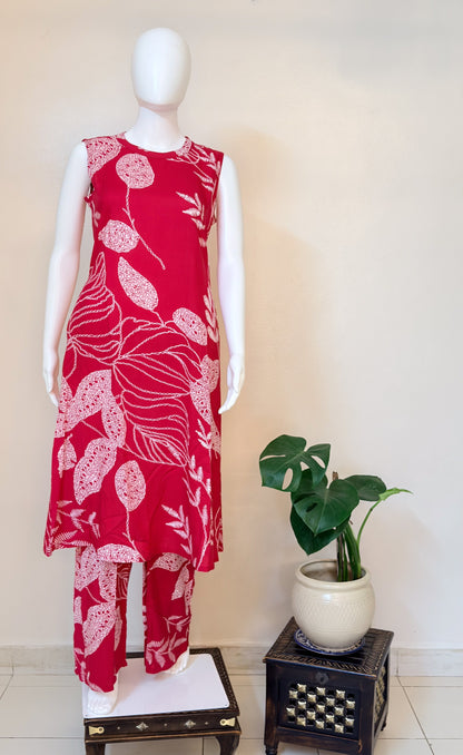 Pink floral coordset on a mannequin with a plant in the background